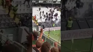 La torcia lanciata verso i tifosi del Cesena dalla curva dell'Ancona