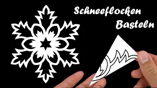 Origami weihnachten: Schneeflocken basteln- Scherenschnitt schneeflocke-Weihnachtsbasteln mit papier