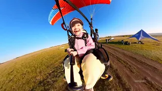 First flight of children on a paraglider with a towed puff