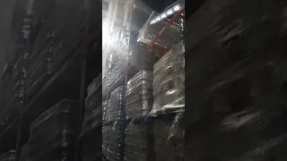 ForkLift Fail pallet hanging from rack