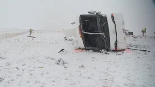 More than 20 hurt when snow-covered roads caused a bus to roll over in Utah