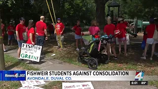 Parents, children demonstrate what walk to new school would look like if Fishweir Elementary closes