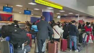 Hundreds of canceled flights cause Christmas chaos for travelers