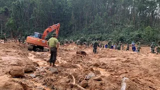 Search underway for 11 Vietnamese army personnel buried in landslide