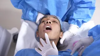 Young Girl Faces Anesthesia Procedure before Cosmetic Surgery