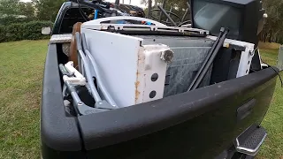 Street Scrapping, filling the back of the truck with scrap