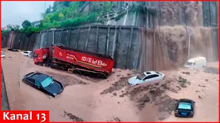 Flooding causes 'waterfall' in China's Chongqing, cars and trucks submerged