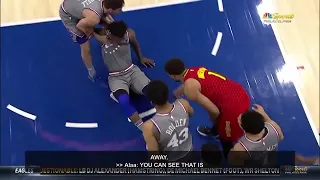 Jimmy Butler being dragged by Tj McConnell