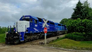 Great Lakes Central 382 and 329 head southbound through Howell, MI. Mixed freight with 2 SD40-2's