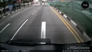 Woman run towards moving car in Singapore