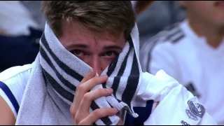 Luka Doncic is crying at the bench, coach Laso comforting him