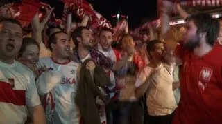 Polish fans celebrate after 1-1 draw with Russia