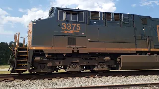Very slow motion ET44 Raising its K5HLLR24 horn on train Q47127 with double tons of hoppers