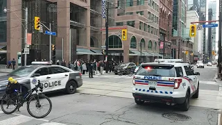 Toronto police ambulance escort shuts down Yonge St in Toronto after shooting