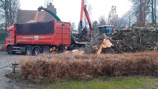 Woodchipper working after flood in Denmark