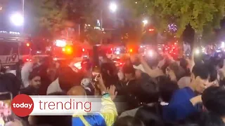 People party next to ambulances after Halloween crowd crush in Itaewon