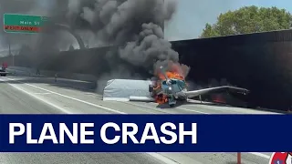 Small plane crashes on California freeway