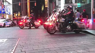 5 NYPD MOTORCYCLE UNITS GOING ON PATROL IN THE TIMES SQUARE AREA OF MANHATTAN IN NEW YORK CITY.