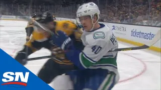 Matt Grzelcyk Drills Elias Pettersson Into The Boards With Late Hit, No Penalty Called