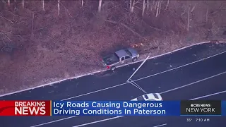 Car spins out, crashes into light pole in icy conditions