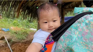 Single mother digs drainage ditch for new house