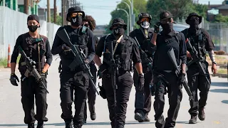 Heavily armed protesters march through Louisville demanding justice for Breonna Taylor