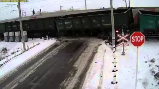 Two trains hit truck on crossing.