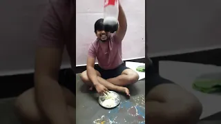 Crazy man eating rice mixed with coca cola