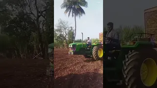 John Deere tractor loaded sugar cane