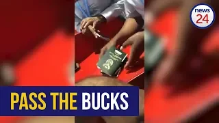 WATCH: OR Tambo Airport security "accept" cash bribe