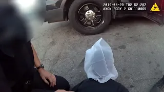 This is police body cam video of Sacramento officers putting a spit mask on a juvenile