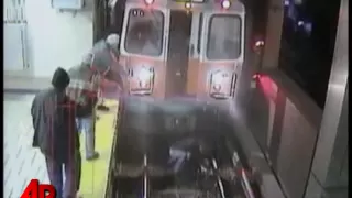 Raw Video: Woman Fell in Front of Oncoming Train