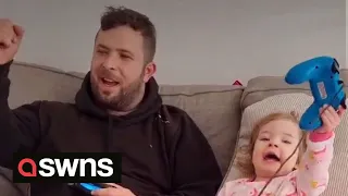 Watch as 2-year-old drops the F-bomb when playing Fortnite with her dad | SWNS