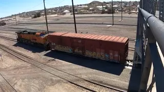 Bnsf dpu with atsf boxcar and intermodal pulling out