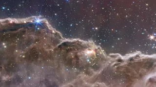 Webb Space Telescope Fly-Through “Cosmic Cliffs” in the Carina Nebula (NIRCam and MIRI Composite)