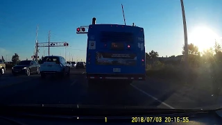 Bus breaking train crossing gate arm