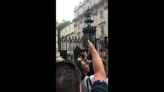 Crowd Boo and Chant Outside Downing Street Amid UK PM Resignation