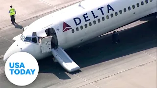 Delta Air Lines plane lands safely without nose gear in Charlotte | USA TODAY