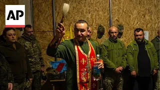 Ukrainian priest on the front line holds Orthodox Easter service for soldiers