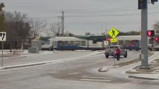 DFW Ice Storm: Truck slides  away from railroad crossing just in time