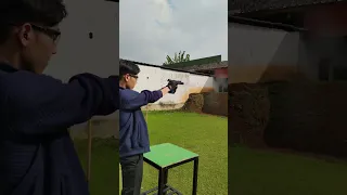 iPhone vs Pistol