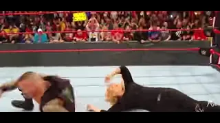 randy Orton giving RKO to Nia Jax