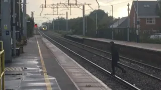 Person JUMPS ONTO RAILWAY TRACKS in front of 390 046