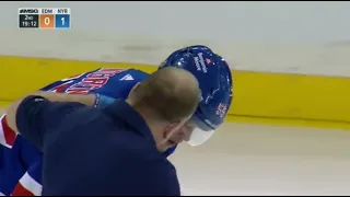 Ryan Lindgren takes a puck off his face