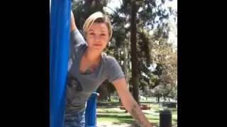 Taking a ride on a pole in the park