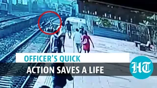 Watch: Female officer rescues man after he collapses & falls on railway track