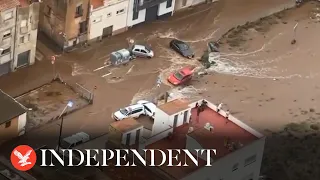 Spain floods: Cars washed away by torrential rain in aerial footage