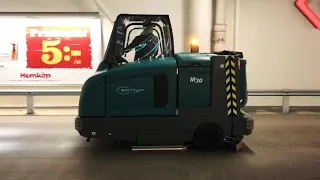 Tennant M30 sweeper-scrubber with high pressure washer for garagecleaning