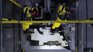 Two Fanuc M10iD Robots Clip and Weld Robotic Cell