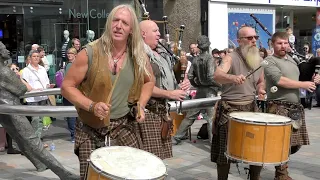 Wild men of Scottish street music Clanadonia playing Spanish Eyes in Perth City Centre Scotland